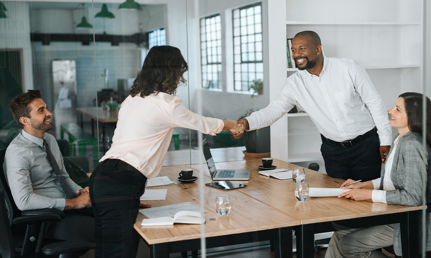 Business man and woman having a handshake