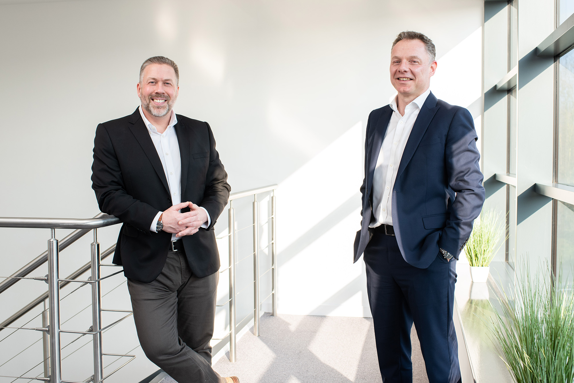 Lee Hartley and Steve McNicol stand in Fairstone's head office