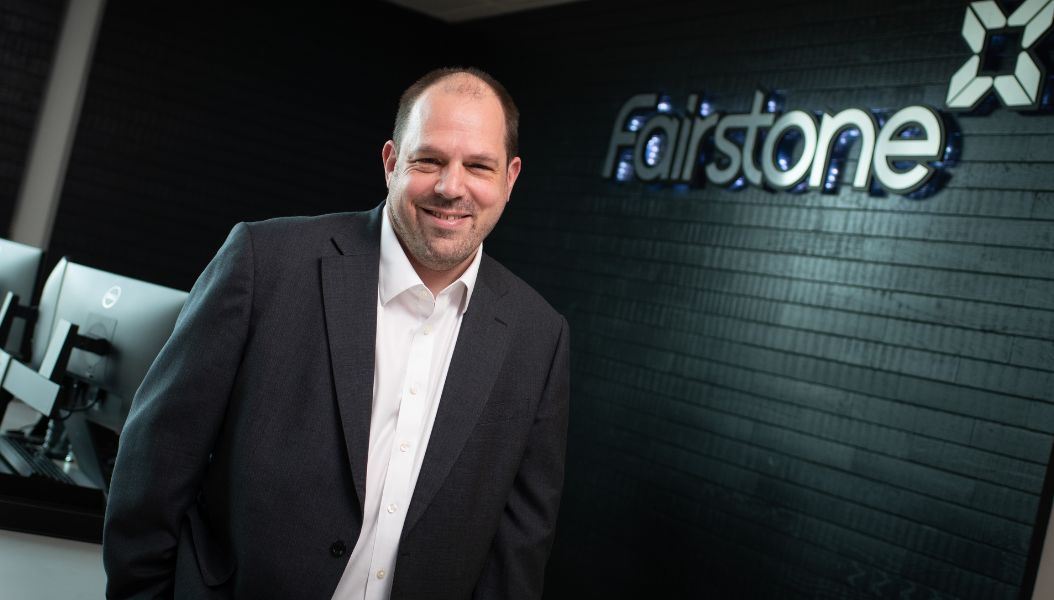 Chief Operating Officer, Nick Stebbing stands in front of Fairstone reception.
